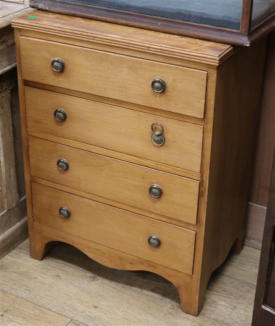 A pine four drawer chest